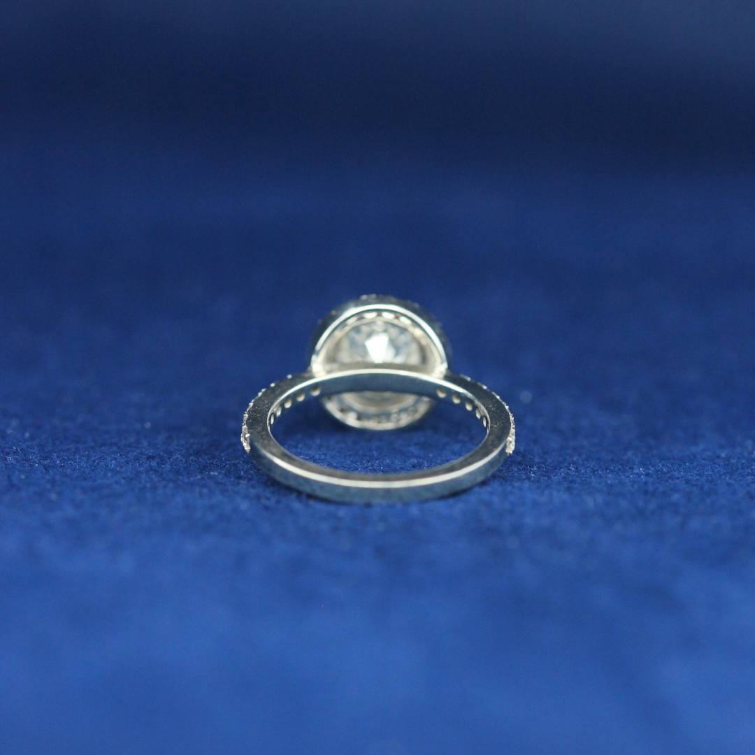 A back-side view of a fine jewelry solitaire diamond ring in 925 sterling silver, highlighting its smooth finish and high-quality craftsmanship.