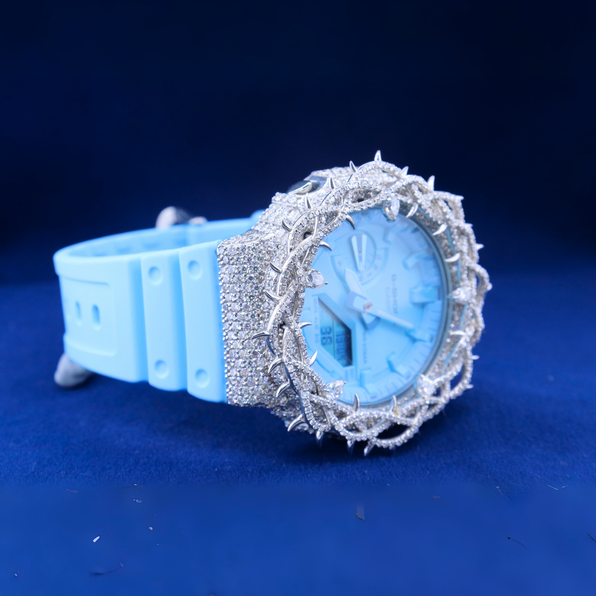 Right angle of the Neon Crown Luxury Timepiece showcasing vibrant moissanite diamond settings and sleek side profile.