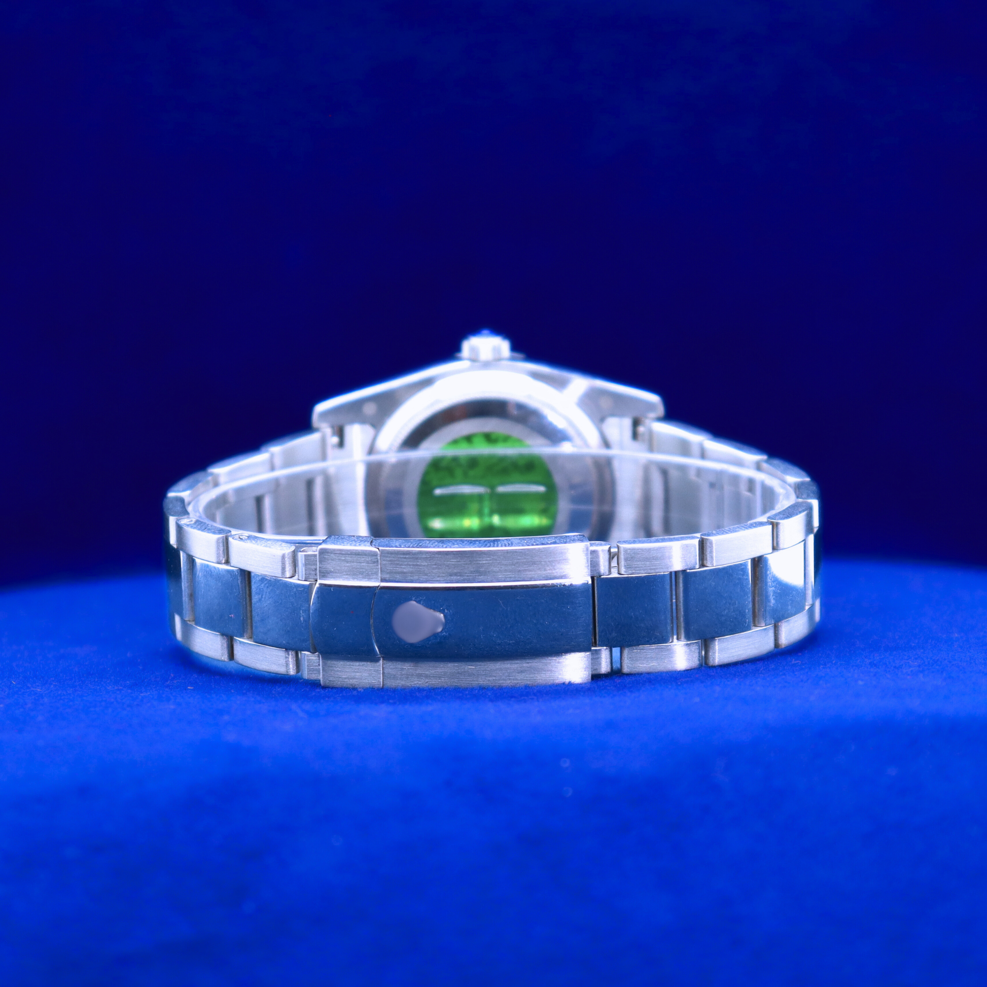Back view of sleek blue dial half iced out custom watch showing stainless steel construction and clean detail