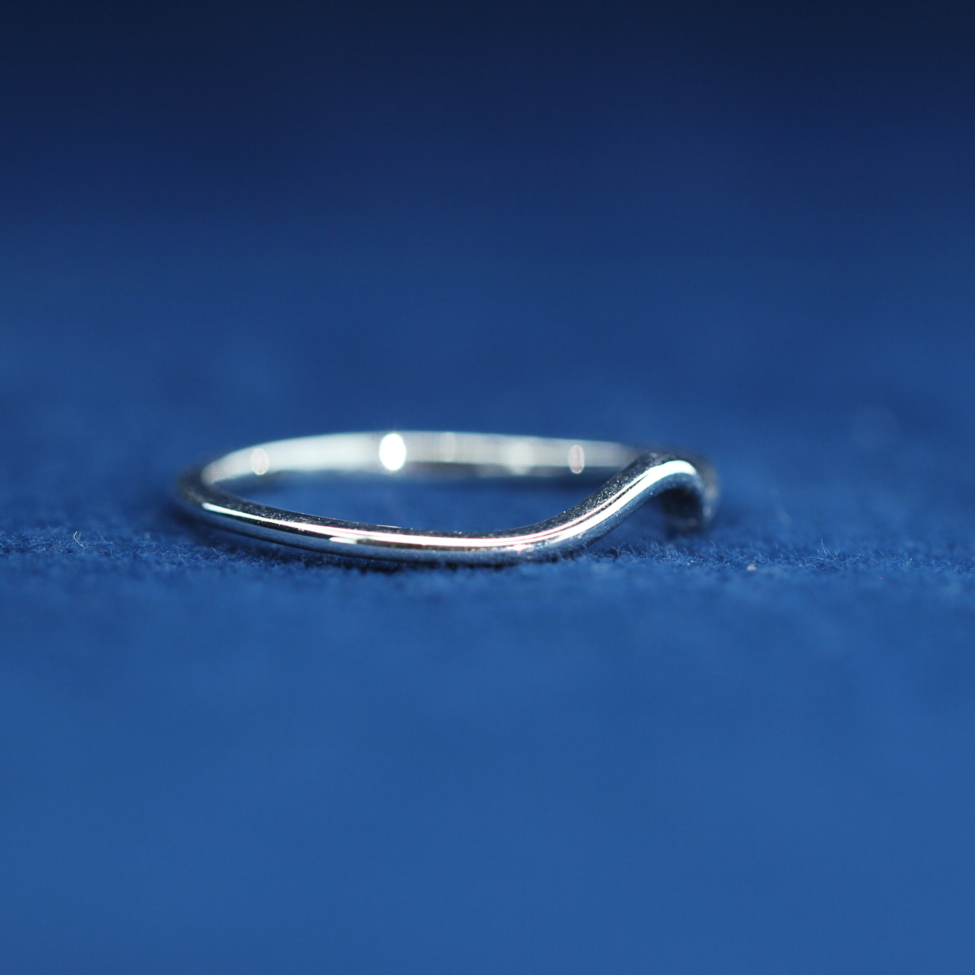 Right angle of 14K sterling silver ring with moissanite detailing – clean, sleek daily jewelry styled with half iced out custom watch.