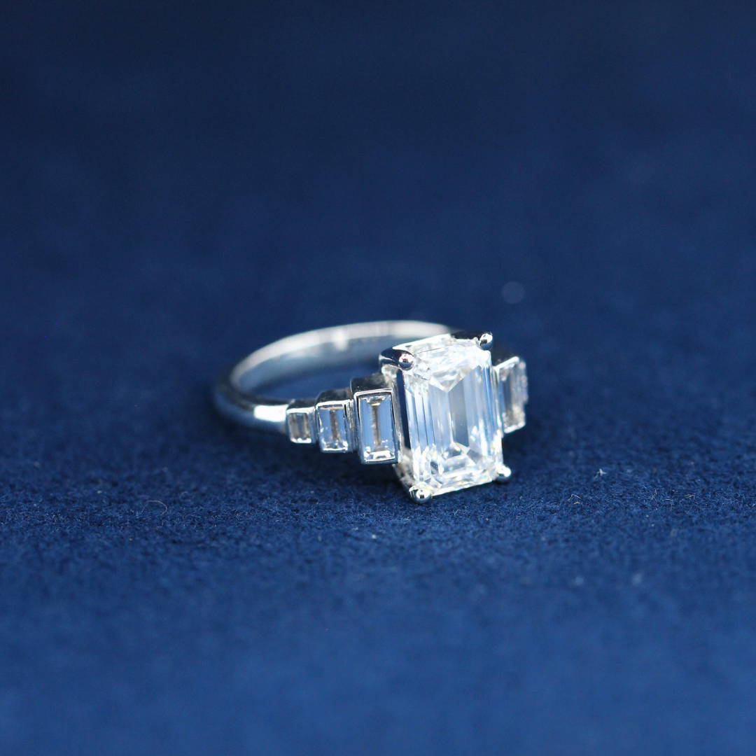  Elegant emerald diamond and moissanite ring in 925 silver, front view showcasing fine jewelry craftsmanship.