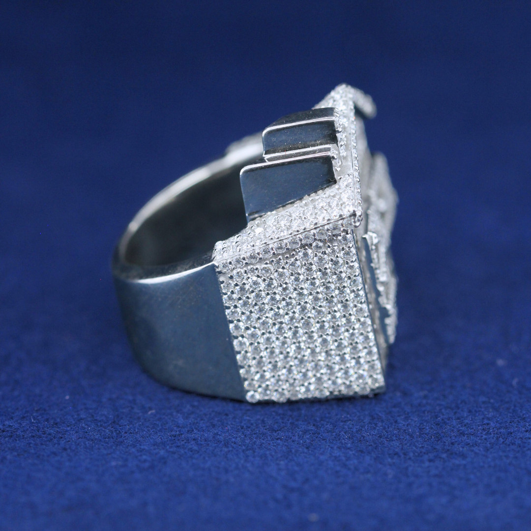 A left-side view of a hip-hop jewelry baguette house ring in 925 sterling silver, highlighting the intricate setting and luxurious baguette-cut moissanite diamonds.